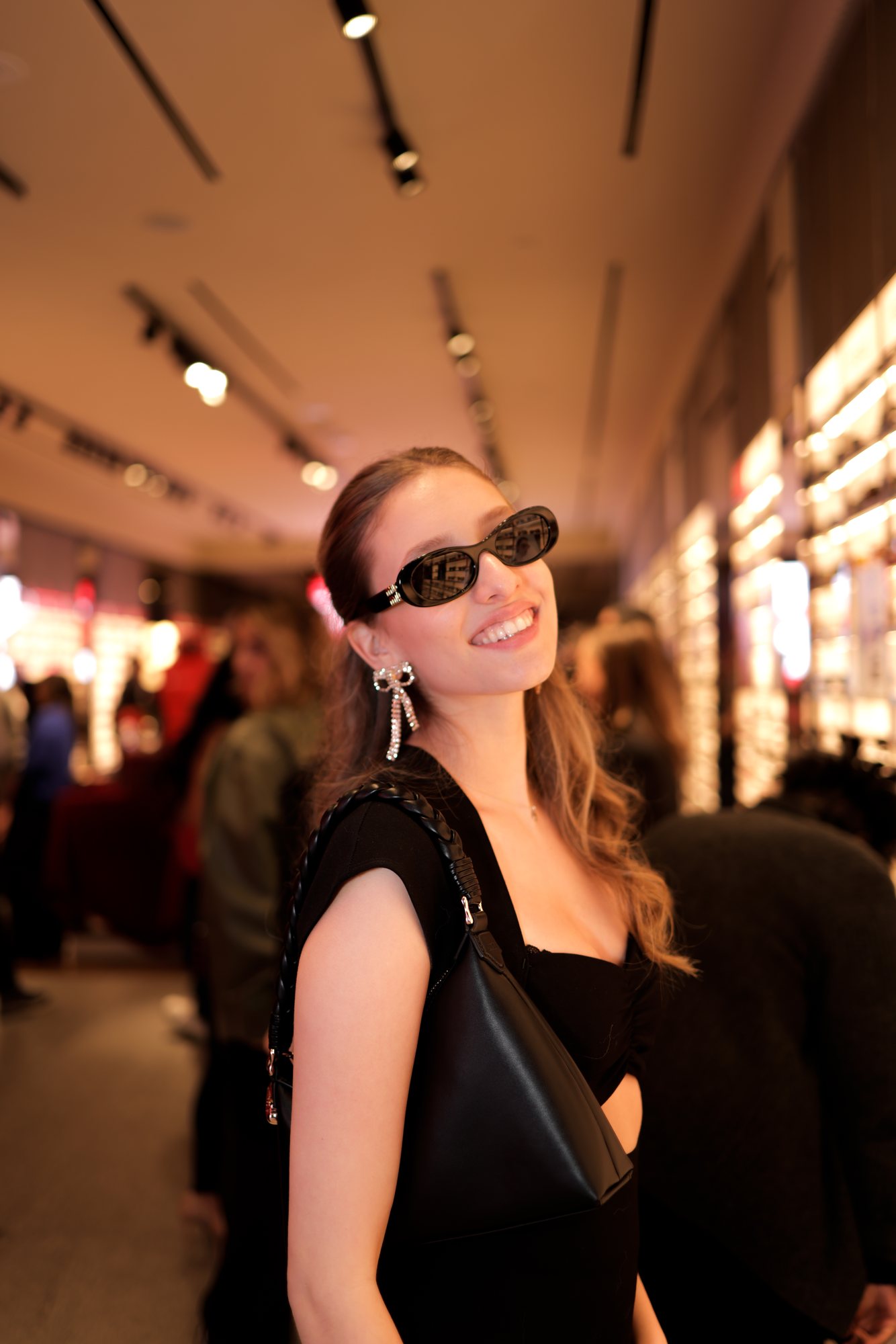 Guest trying on sunglasses during the holiday program