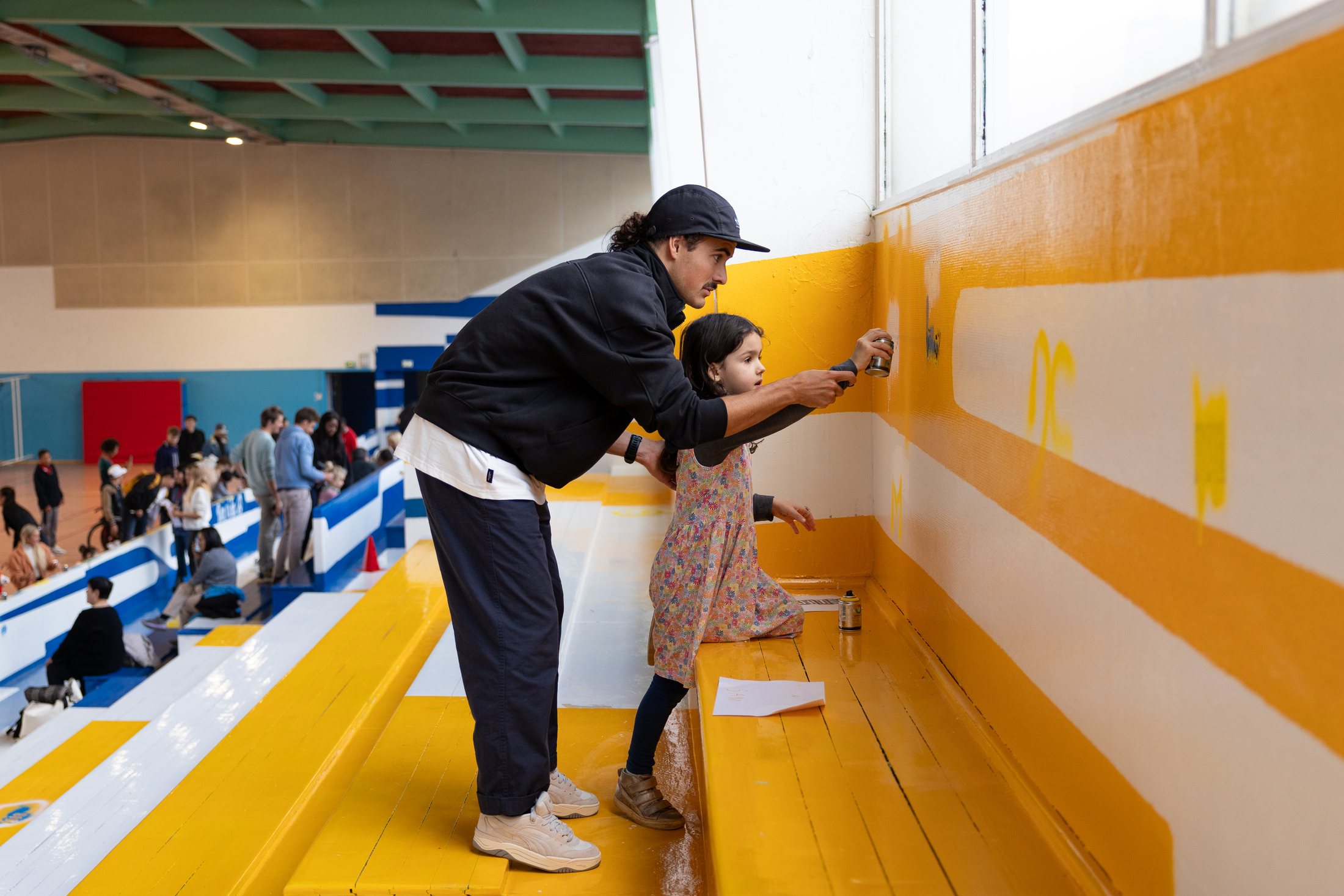A family participating in the community art activation
