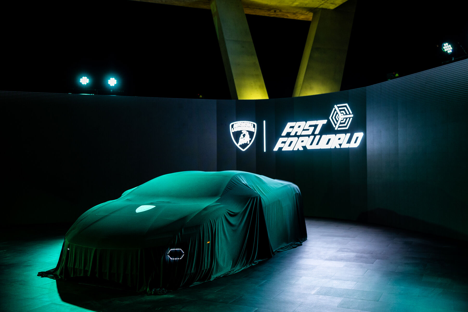 The covered reveal car ahead of doors on the rooftop deck