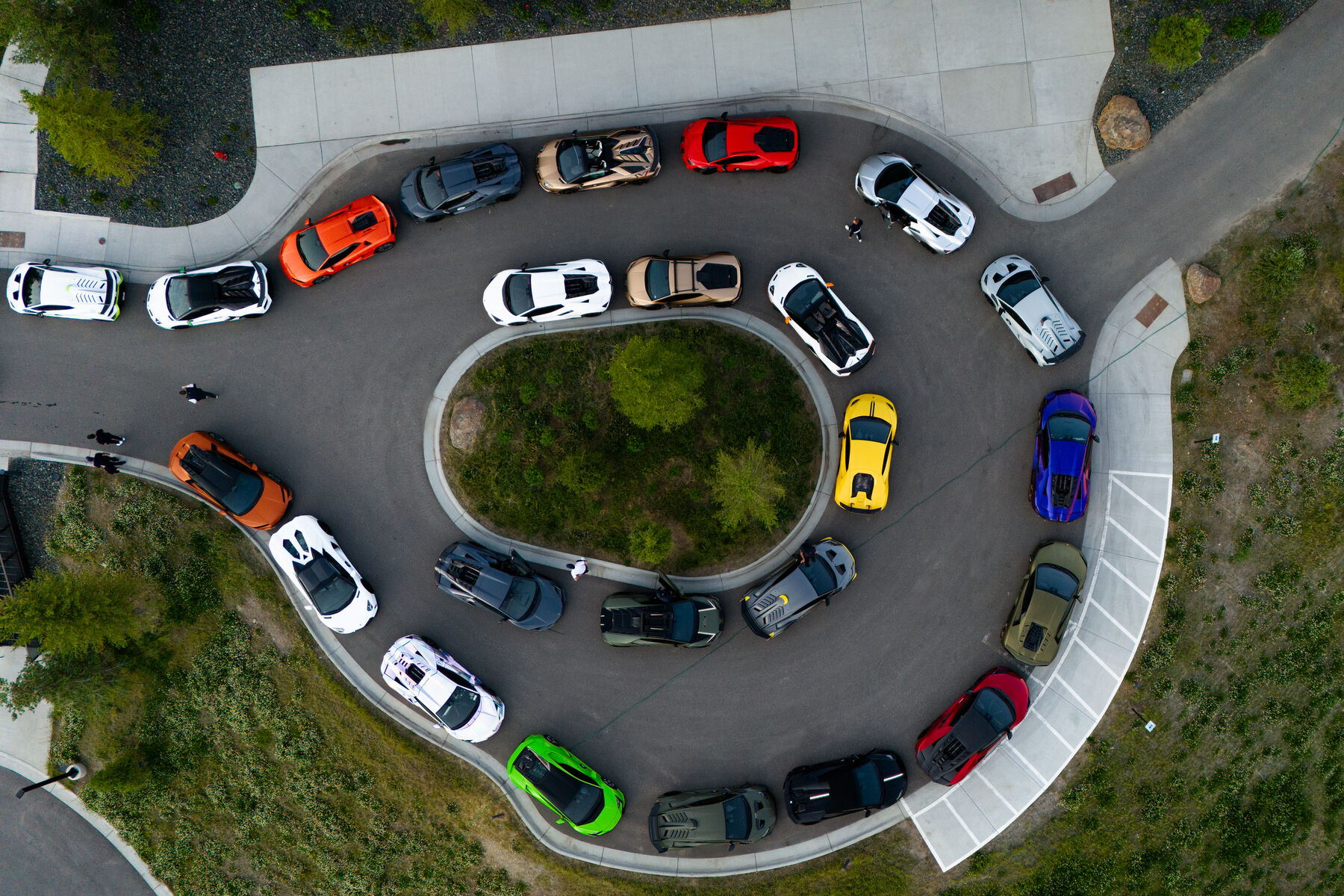 Overhead view of the supercar fleet staged on a hotel forecourt