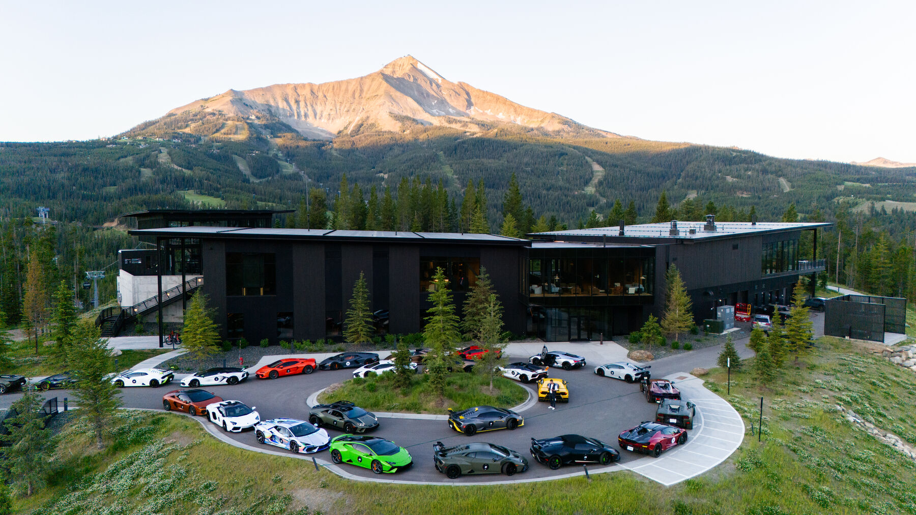 The Lamborghini fleet staged in a circle outside the Big Sky property at sunrise