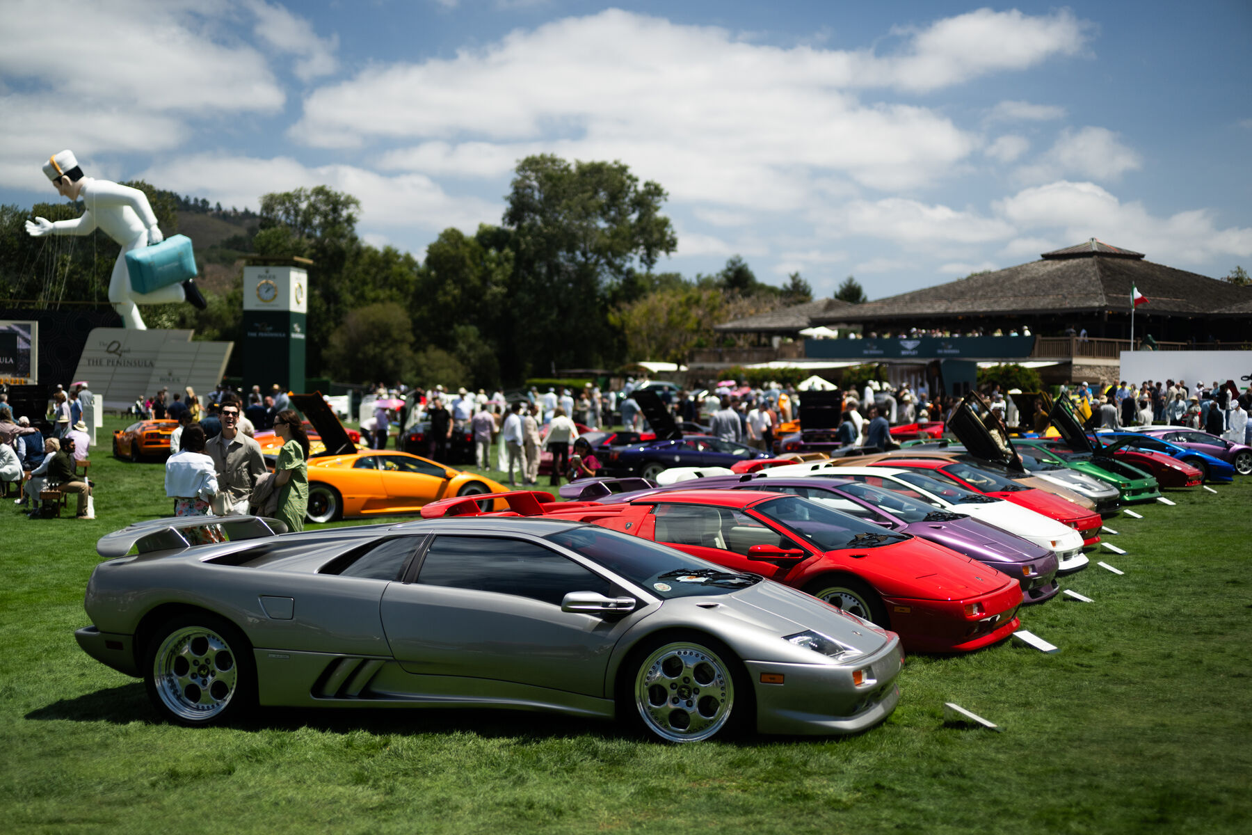 A row of classic Lamborghinis on the lawn at The Quail