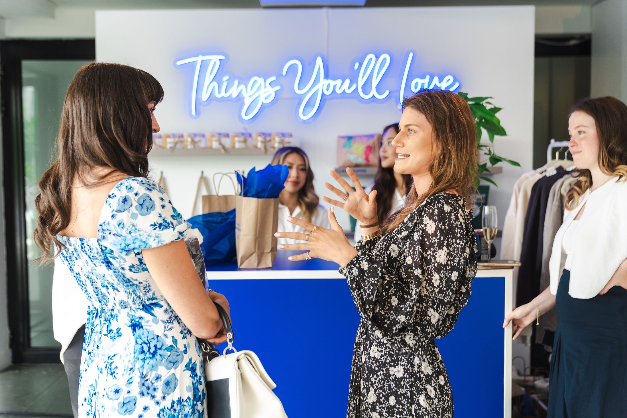 Guests exploring the Visa She's Next gifting display