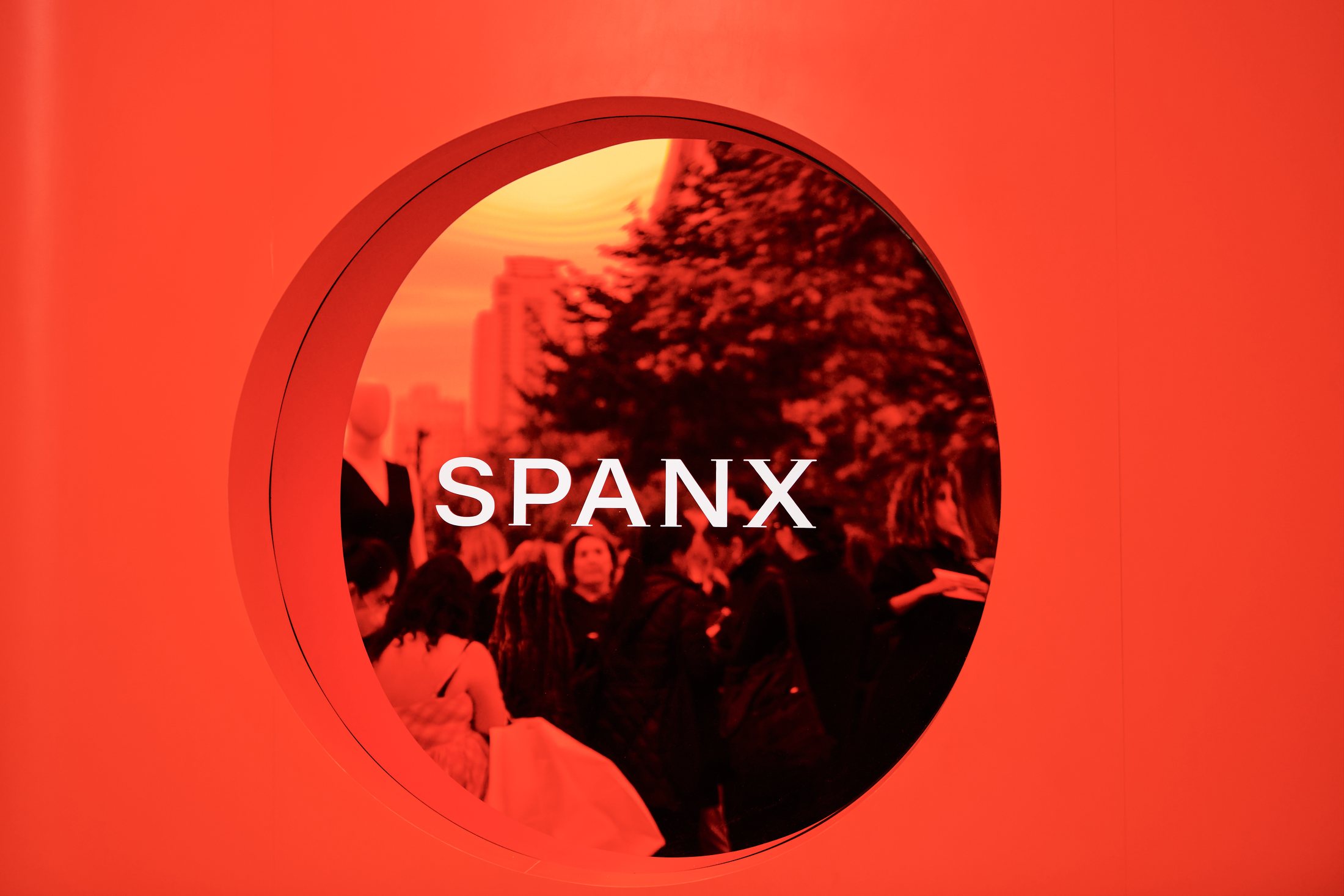 Spanx wordmark framed inside the red installation