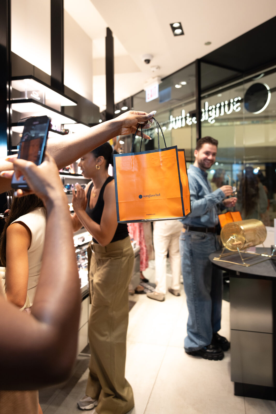 Guests and gifting at a Sunglass Hut summer event
